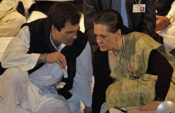 Rahul Gandhi speaks to Sonia Gandhi during the Indian National Congress meeting in Jaipur