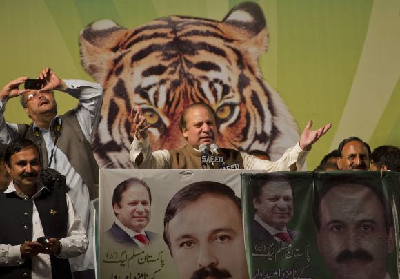Nawaz Sharif (C), leader of political party Pakistan Muslim League - Nawaz (PML-N), addresses an election rally in Islamabad
