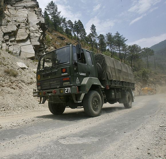 An Indian army truck drives along India's Tezpur-Tawang highway, which runs to the Chinese border
