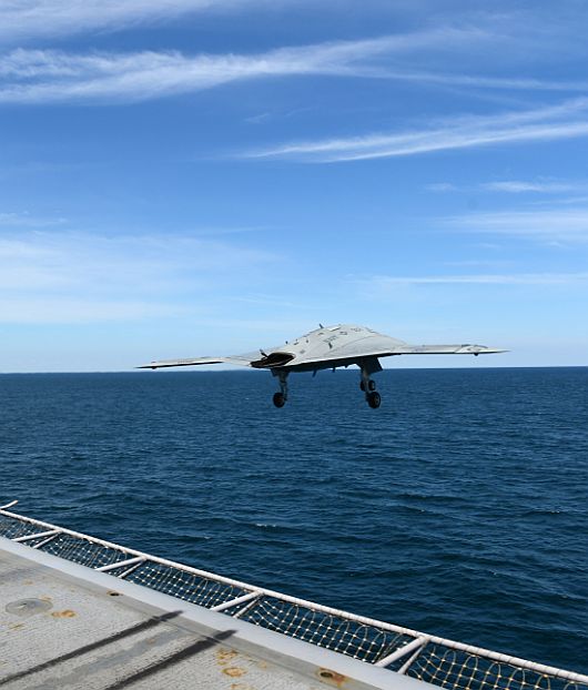 An X-47B Unmanned Combat Air System demonstrator launches from the flight deck of the aircraft carrier USS George H W Bush