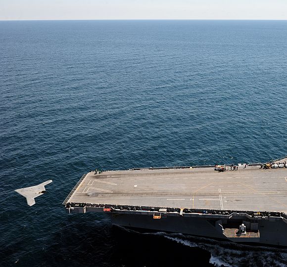 An X-47B Unmanned Combat Air System demonstrator launches from the flight deck of the aircraft carrier