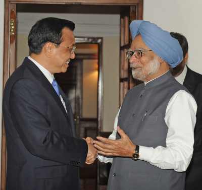 Prime Minister Manmohan Singh interacts with his Chinese counterpart Li Keqiang in New Delhi on Sunday