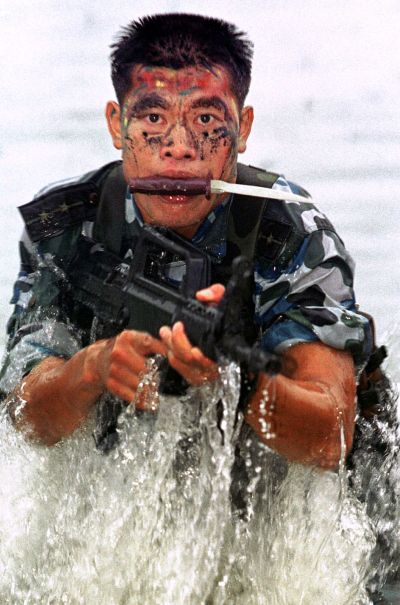 A Chinese marine goes through routine training at an undisclosed