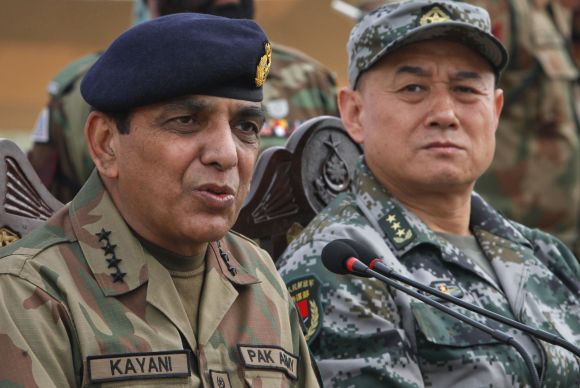 Pakistani Army Chief General Ashfaq Kayani speaks beside Chinese General Hou Shusen after a joint military exercises in Pakistan