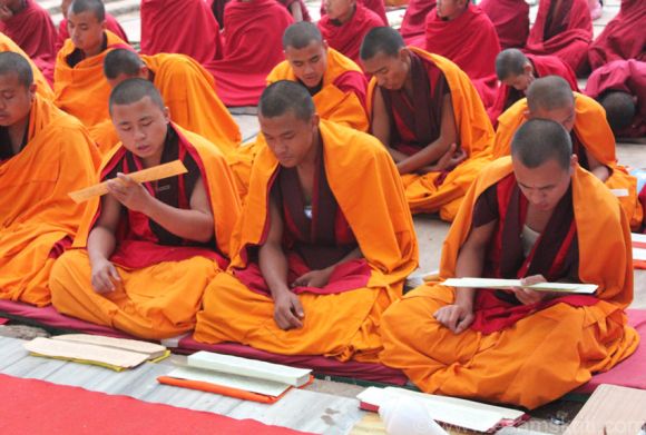 Buddhist monks reading scriptures in Bodh Gaya