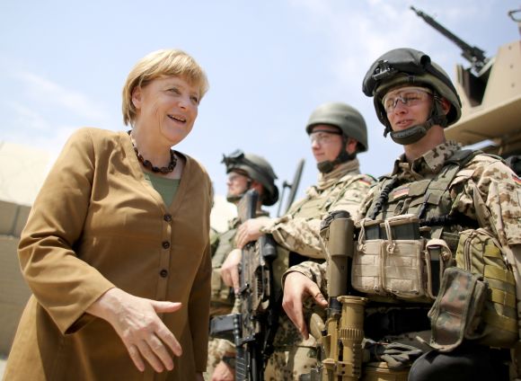 Chancellor Angela Merkel meets with soldiers as she visits a German army base in Afghanistan