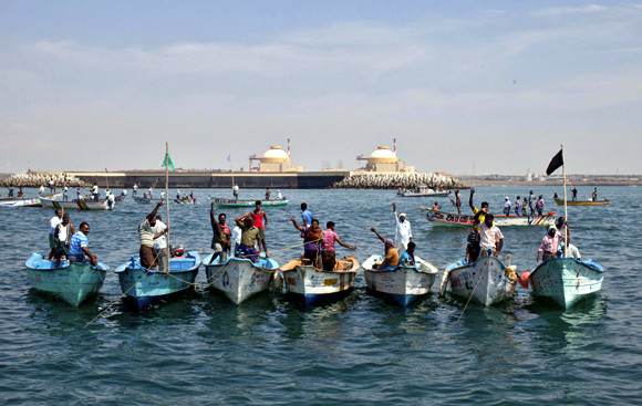 Demonstrators stand in their boats in the Bay of Bengal during a protest near the Kudankulam nuclear power project