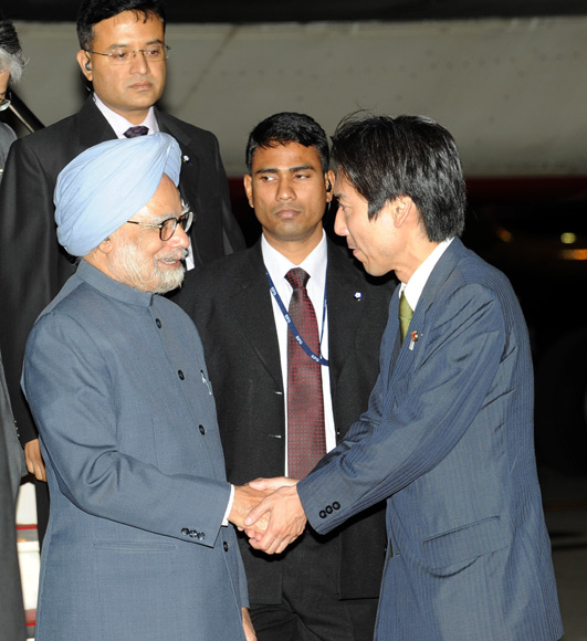 PM being received at the airport by Minoru Kiuchi, Japan's parliamentary vice-minister for foreign affairs