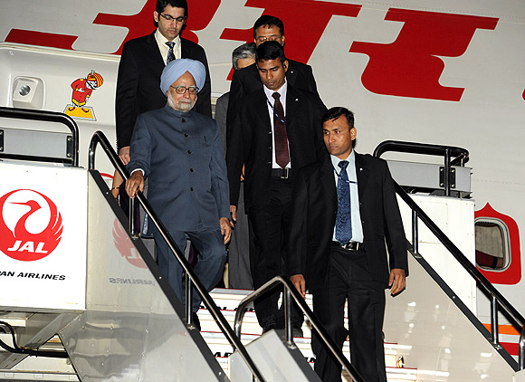 Prime Minister Manmohan Singh steps out of Air India One on his arrival at Tokyo's Haneda International Airport