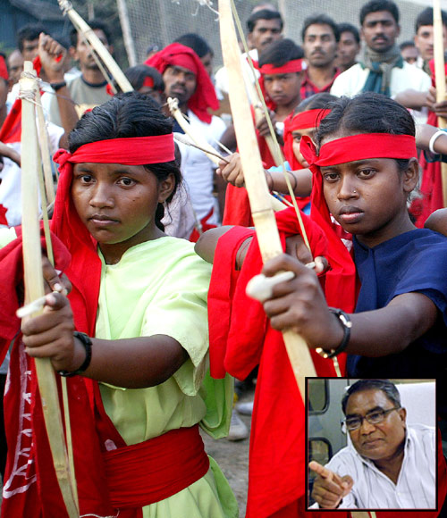Female Naxalite fighters pose with the bow and arrow at a rally in Kolkata. Inset: Mahendra Karma