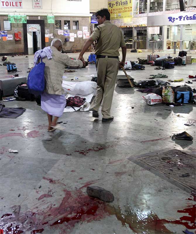A policeman and an elderly man at the CST station in Mumbai, one of the sites of the 26/11 attacks.