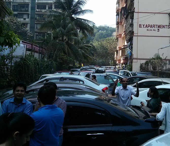 Residents parked their cars near the gates to block the BMC staff from entering the compound.