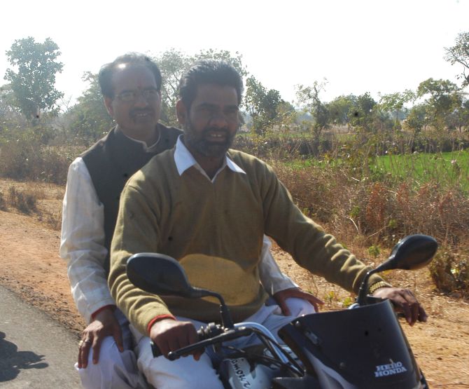 Shivraj Singh Chouhan travels on a motorbike to reach the venue of his rally in MP