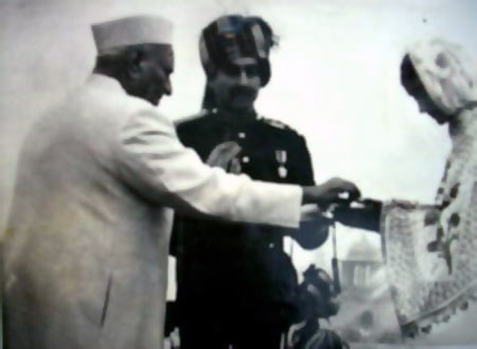 A hero's widow is awarded the Param Vir Chakra by the President of India.