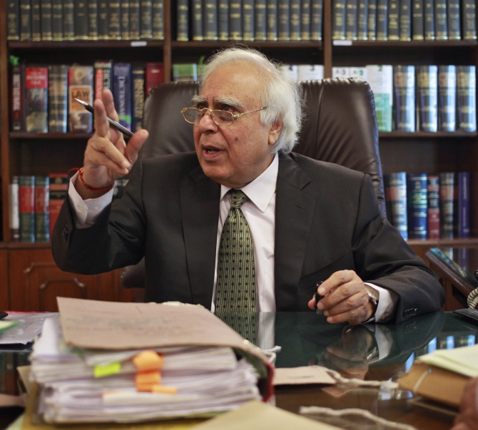 Telecommunications Minister Kapil Sibal gestures after an interview at his office in New Delhi