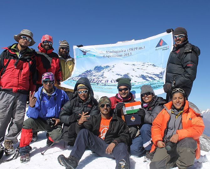 The 12-member Summitng4Hope team atop Mt Rudugaira