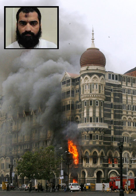 The Taj Mahal hotel is seen engulfed in smoke during a gun battle in Mumbai in this picture taken on November 29, 2008. 