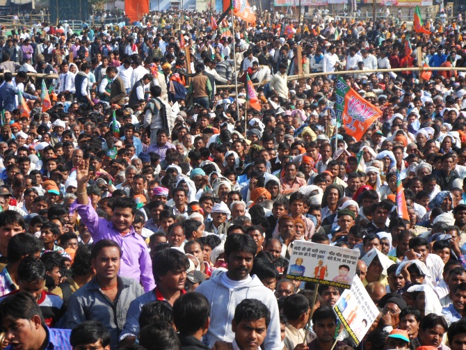 Over 100,000 people braved a hot afternoon sun for more than four hours, waiting for Modi