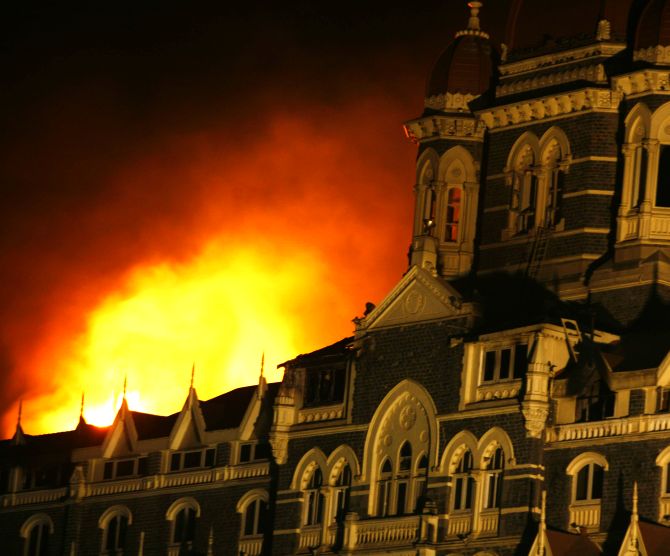 Smoke and fire billows out of the Taj Hotel in Mumbai during the 26/11 terror attacks