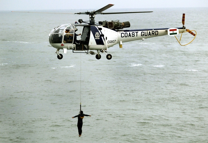 The Coast Guard's Chetak helicopter takes part in a demonstration near the Mumbai coast.