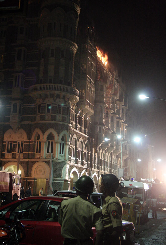 November 26, 2008, after midnight: Police constables outside a burning Taj Mahal hotel. Photograph: Uttam Ghosh/Rediff.com