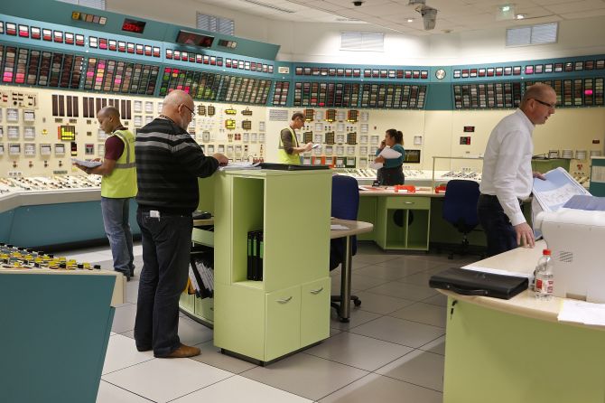 Employees of the French government-owned electricity company EDF work in a simulated control room at the oldest French nuclear power station in Fessenheim during a nuclear accident drill.