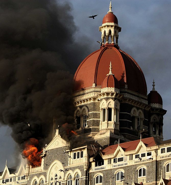 Smoke billows from the Taj Mahal hotel during the 26/11 attacks.