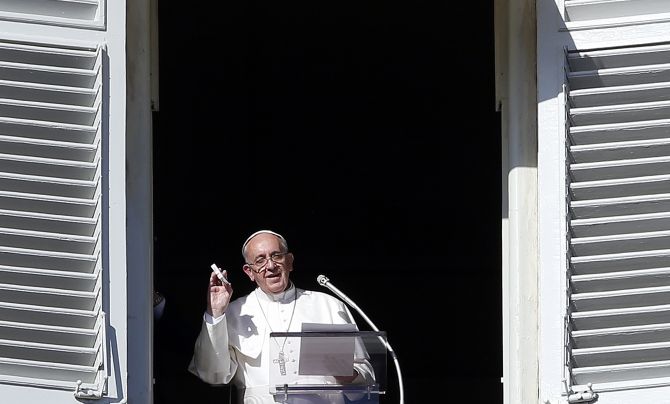 Pope Francis shows a rosary box during his Sunday prayer in St. Peter's square at the Vatican 