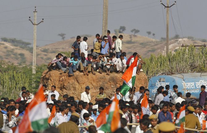 Congress party supporters await Sonia Gandhi's arrival at a rally in Dungarpur town, Rajasthan.