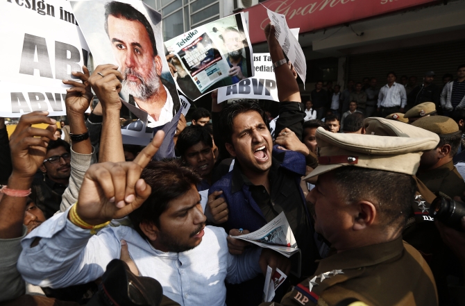 Protesters shout slogans against Tarun Tejpal