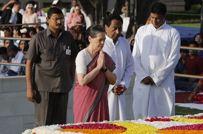 Congress chief Sonia Gandhi and Union minister Kamal Nath pay homage at the Mahatma Gandhi memorial on Friday