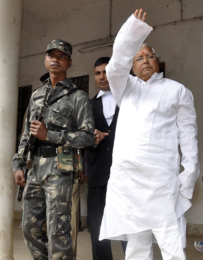 Lalu waves to his supporters outside a court in Ranchi  