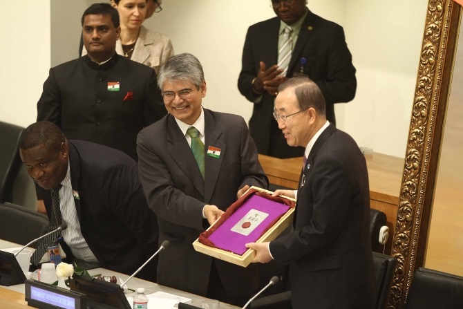 Ambassador Asoke K Mukerji presents a special edition of a book on Gandhi to UN Secretary General Ban Ki-moon