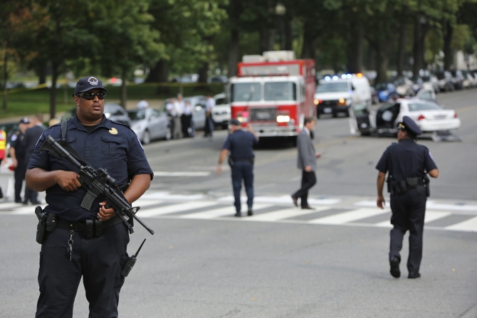 FBI agents patrol the area after gunshots were fired outside the US Capitol building in Washington