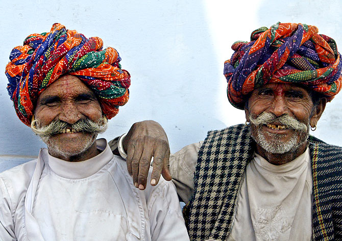 Rajasthani men pose during the Pushkar fair in Rajasthan.