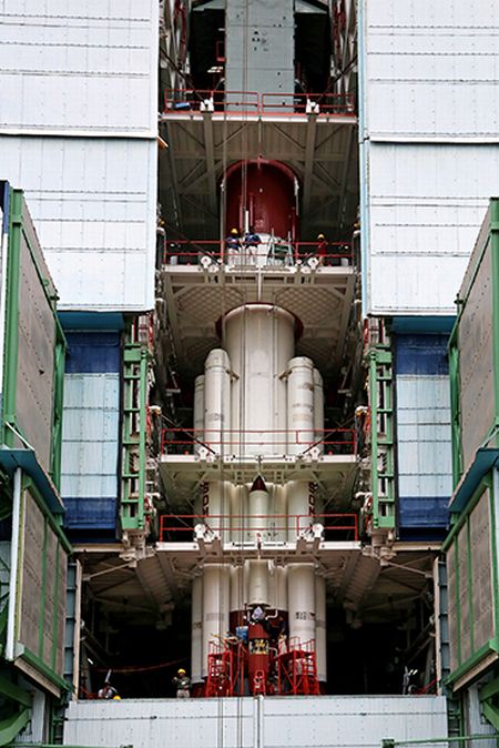 PSLV-C25 first stage being surrounded by strap-ons in the Mobile Service Tower