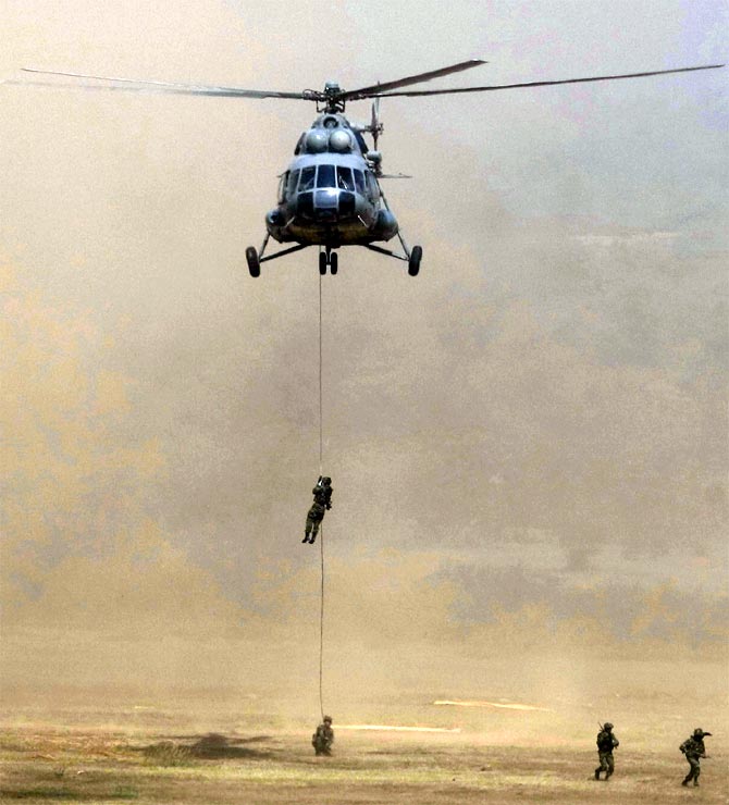Army soldiers rappel down a MI-17 helicopter during 'Yudh Abhyas', a joint Indo-US training exercise in Babina, Uttar Pradesh