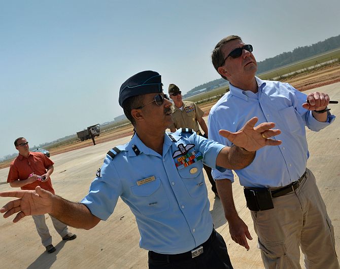 Anil Sabharwal of the Indian Air Force gives US Deputy Secretary of Defence Ashton B Carter a walking tour of a new runway being built at Hindan Air Force Station near Delhi, September 18