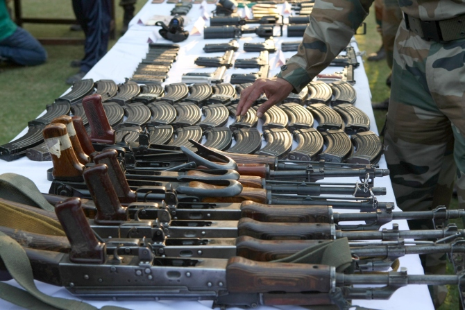 Arms and ammunition recovered during the Keran operation is displayed at the press conference