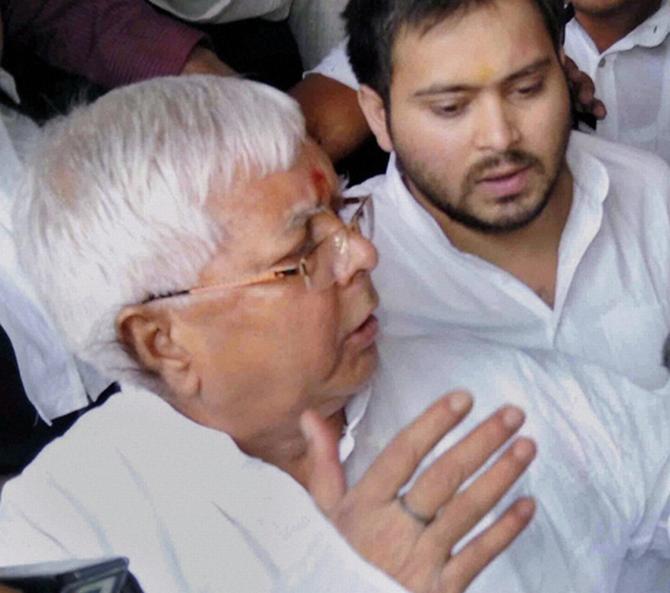 Lalu Prasad with his son Tejaswi outside a Ranchi court