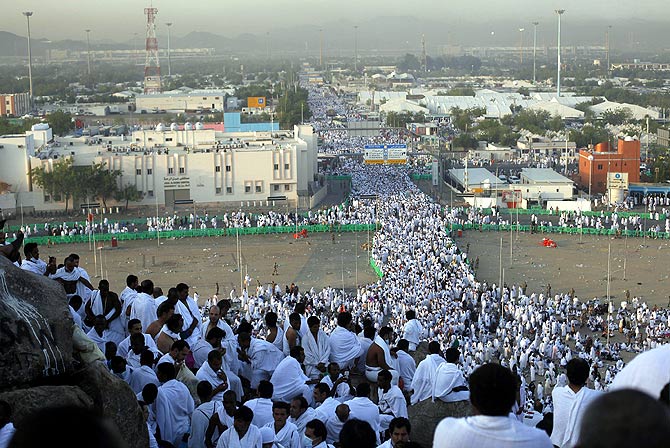 Muslim pilgrims gather atop Mount Mercy on the plains of Arafat during the peak of the annual haj pilgrimage, near the holy city of Mecca