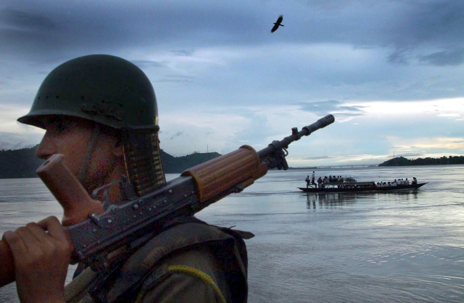 A paramilitary trooper on the banks of the Brahmaputra on the outskirts of Guwahati.