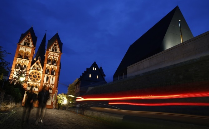 A car drives past the residence of Bishop Franz-Peter Tebartz-van Elst next to Limburg Cathedral in Limburg