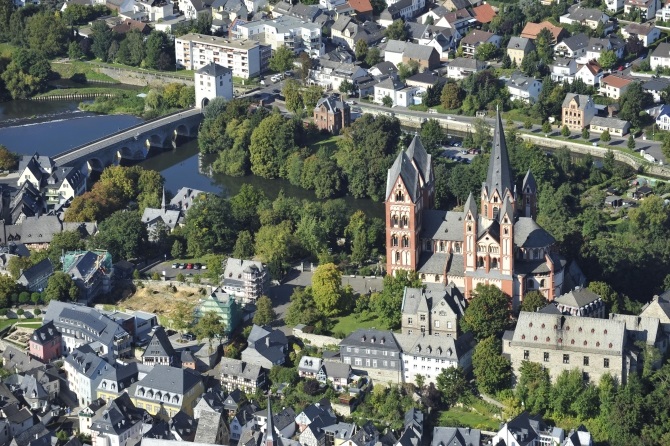 An aerial view shows Limburg cathedral (right) and to the left the construction site for the ensemble of the bishop of Limburg's residence along the river Lahn 
