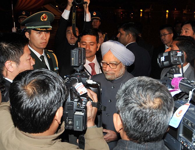 Dr Singh interacting with the media persons at the Beijing International Airport