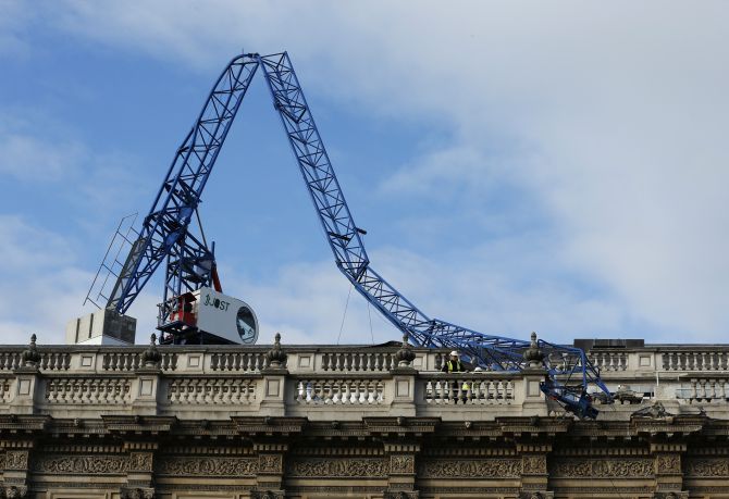 A collapsed crane lies on the roof of the Cabinet Office in London