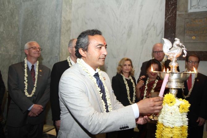 Dr Ami Bera lights up the ceremonial diya