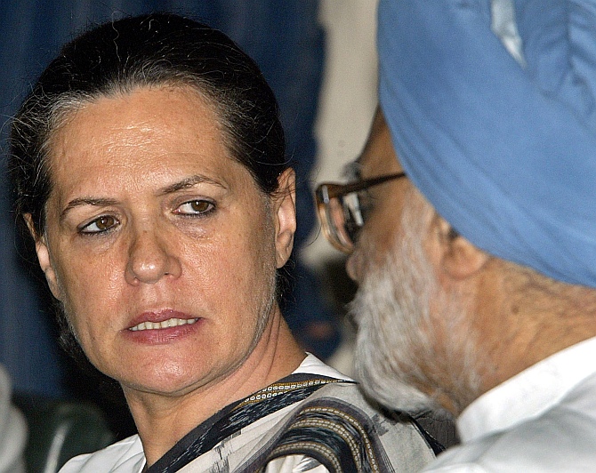 Congress president Sonia Gandhi talks with Singh during a meeting. 