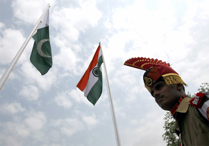 An Indian soldier stands guard during a fair at Chamliyal in Jammu and Kashmir 