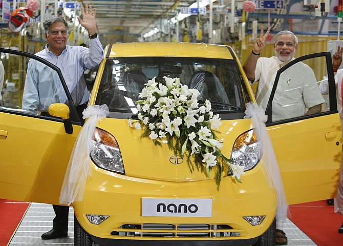 Ratan Tata, then chairman of the Tata Group, and Modi at the Tata Nano plant at Sanand in Gujarat